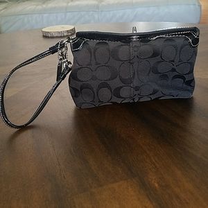 Coach wristlet with silver toggle closure